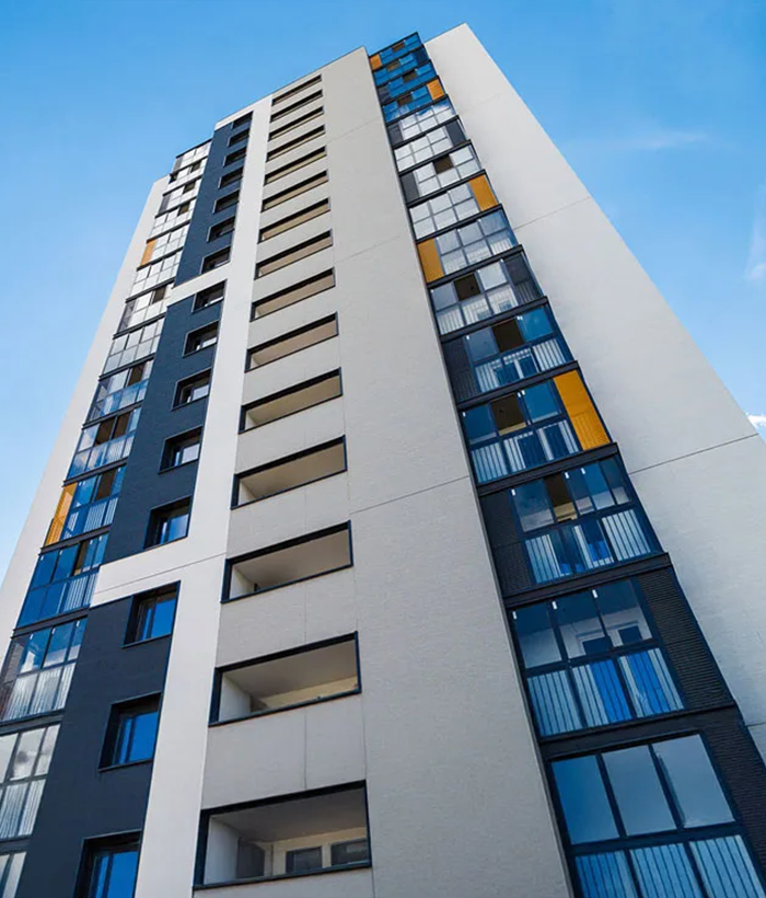 Modern high-rise residential apartment building in UAE with glass facade used for property management and rental occupancy case study