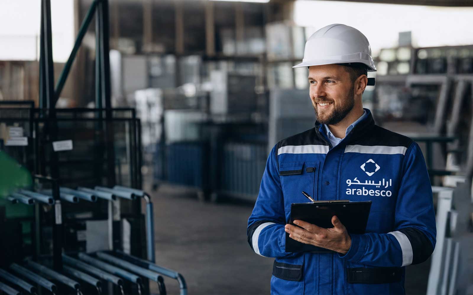 Facility management engineer monitoring building systems and asset performance using tablet in Abu Dhabi